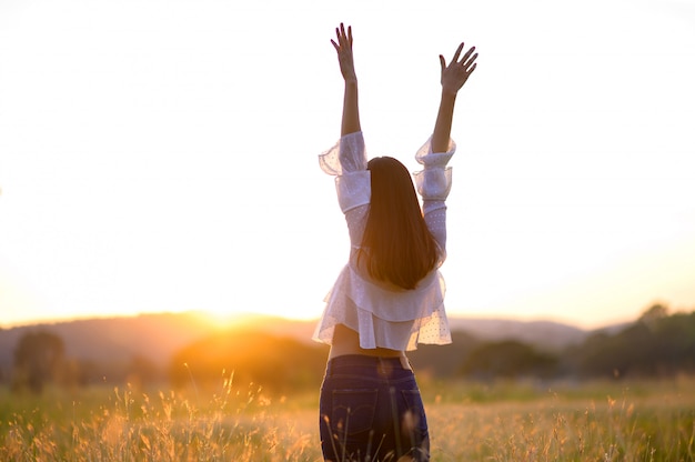 https://image.freepik.com/free-photo/girl-enjoying-nature-on-the-field-sun-light-glow-sun-free-happy-woman_35534-243.jpg