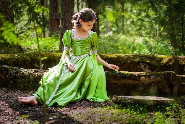 https://image.freepik.com/free-photo/girl-fairytale-elf-dress-sits-barefoot-ancient-ruins-forest-playing-with-butterfly_298446-730.jpg