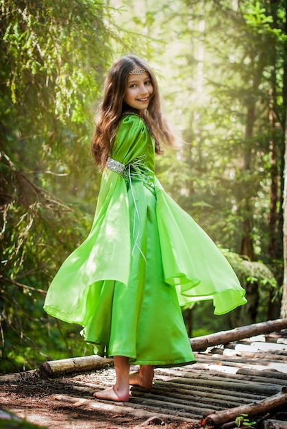 https://image.freepik.com/free-photo/girl-fairytale-elf-dress-walks-barefoot-along-forest-path-turning-around_298446-724.jpg