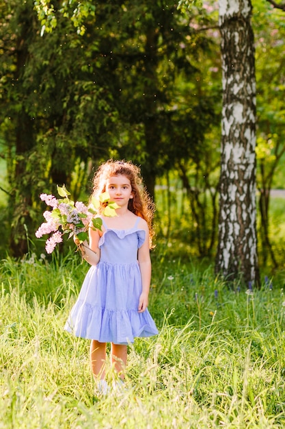 Free Photo | Girl holding bunch of wildflower in park