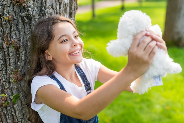 holding a stuffed animal