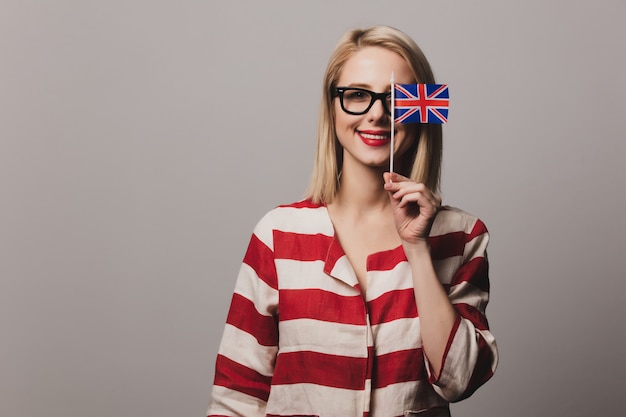 Premium Photo | Girl holds british flag