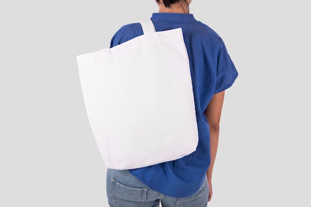 Premium Photo | Girl is holding bag canvas fabric for mockup blank ...