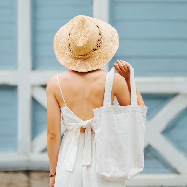 Download Premium Photo | Girl is holding eco bag for mockup blank ...