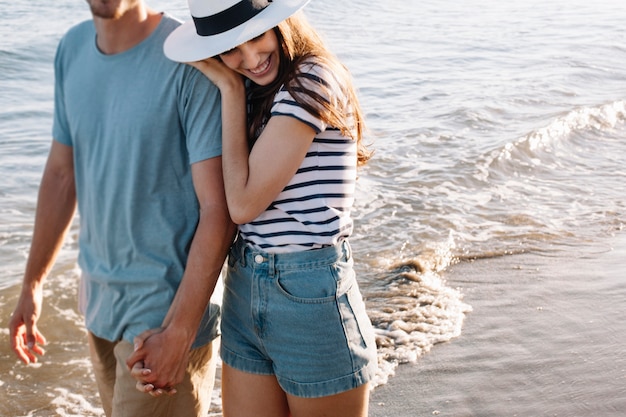 Free Photo | Girl leaning at shoulder of boyfriend at the beach