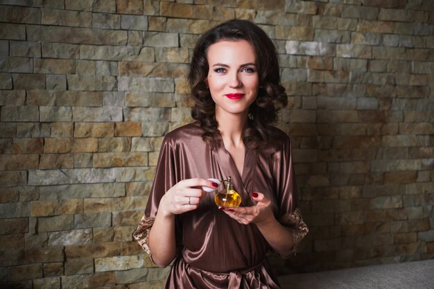 Girl Pinup With Brunette Hair And Retro Make Up With Red Lips In A