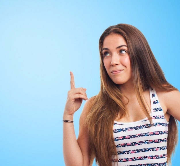 Girl putting pointer finger out Photo | Free Download