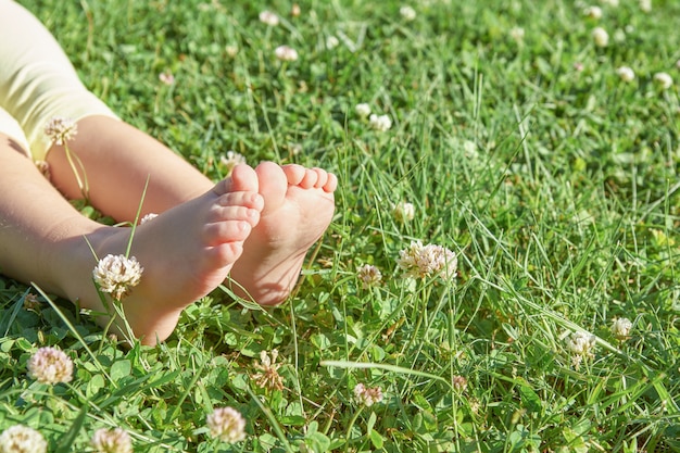 Premium Photo Girl S Feet On The Grass