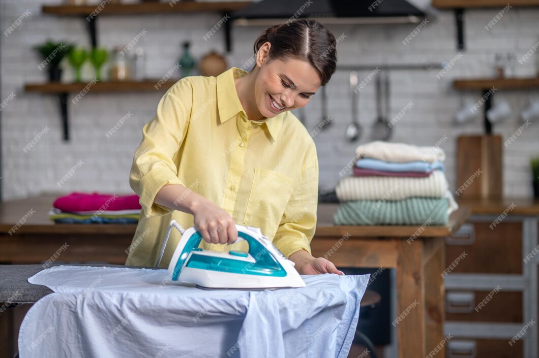 free-photo-girl-smoothing-out-wrinkles-on-the-shirt-with-a-steam-iron