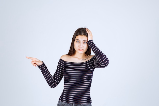 Free Photo | Girl in striped shirt holding her head as she is exhausted ...