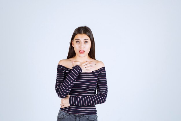 Free Photo | Girl in striped shirt pointing at herself.