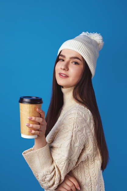 Premium Photo Girl Wearing White Hat And Sweater Enjoys Drinking