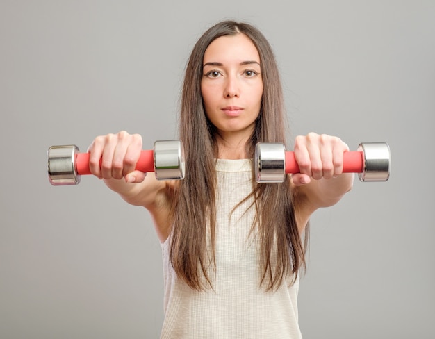 Premium Photo | Girl with dumbbells