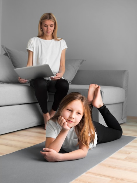 Free Photo Girl With Mom Doing Sport On Mat