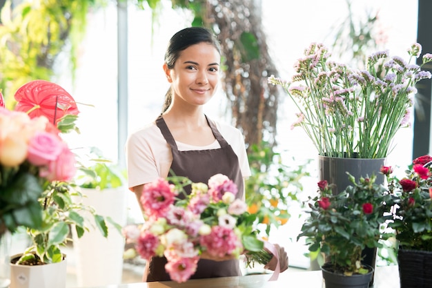 Girl working in florist shop Premium Photo