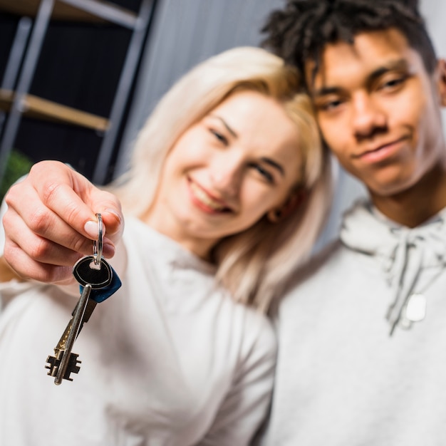 Girlfriend with her boyfriend showing house key toward camera Free Photo