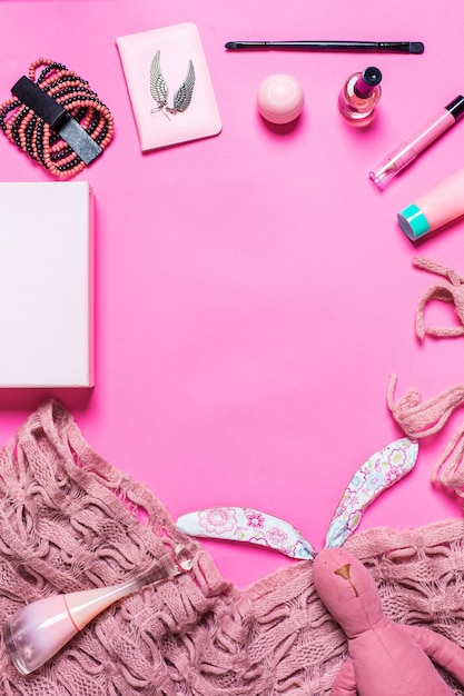 Premium Photo | Girls accessories on a pink background