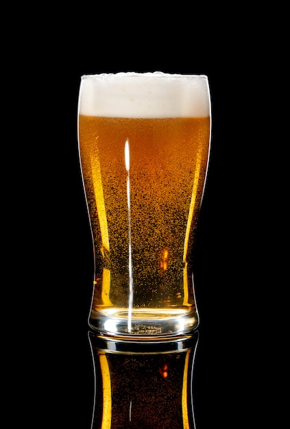 Premium Photo Glass Of Beer On A Black Background