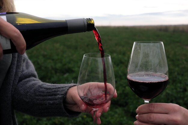 Premium Photo Glass And Bottle Of Red Wine Outdoors Pouring Drinks