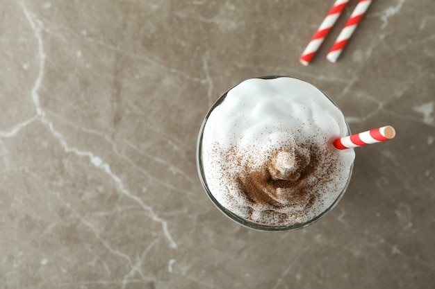 Premium Photo | Glass of chocolate milkshake on gray background