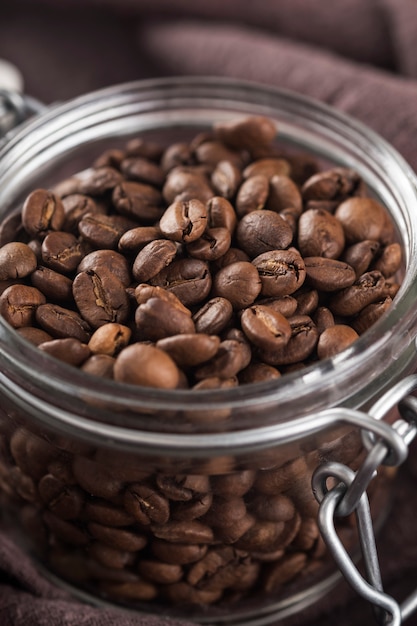 Download Glass jar roasted coffee beans. | Premium Photo
