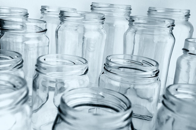 Premium Photo | Glass jars on white background