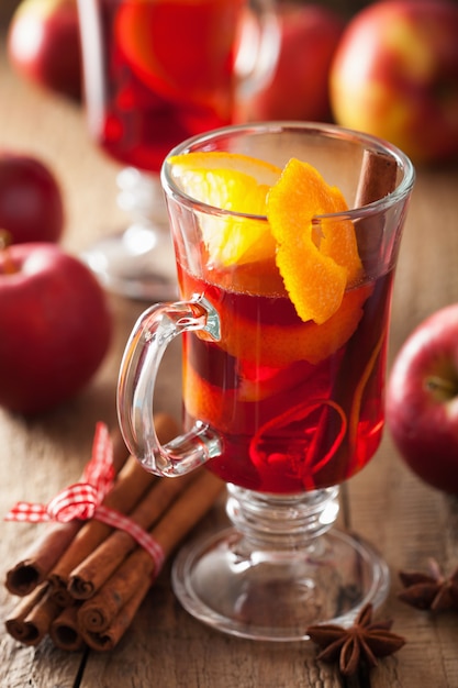 Premium Photo | Glass of mulled wine with orange and spices