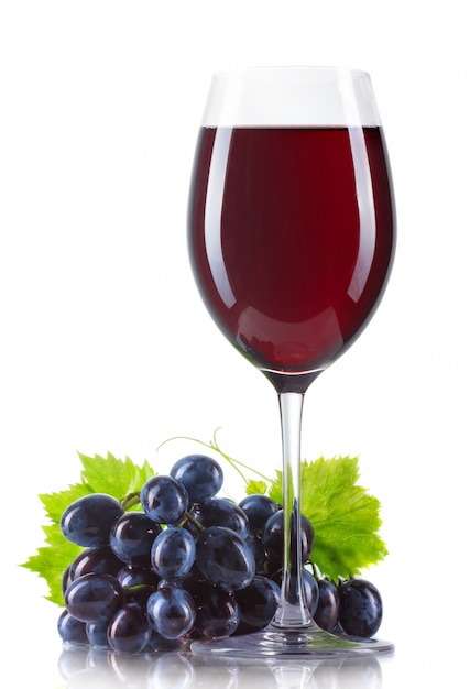 Premium Photo | Glass of red wine with bottle and ripe grapes isolated