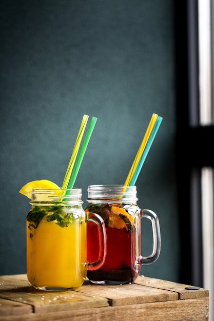 Premium Photo | Glass trend jar with holiday juice with fruits