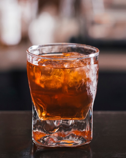 Download Free Photo | Glass of whiskey with ice cube