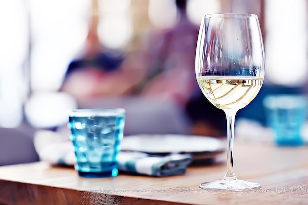 Premium Photo | Glass of white wine in the restaurant / white wine in ...