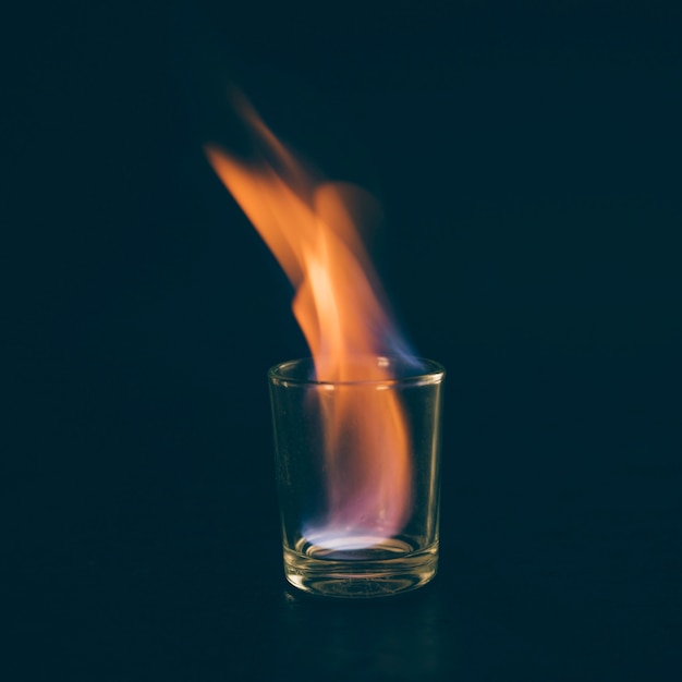 Free Photo Glass With Burning Alcohol On Black Background