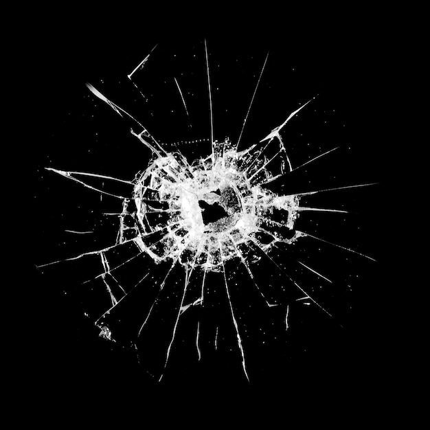 Premium Photo | Glass with a hole and cracks isolated on a black background