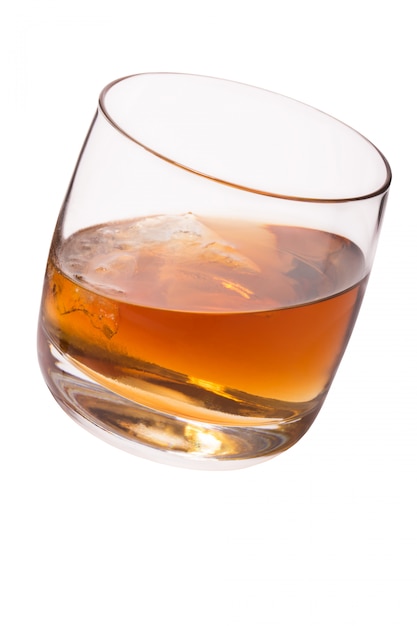 Premium Photo | Glass with whiskey and ice isolated