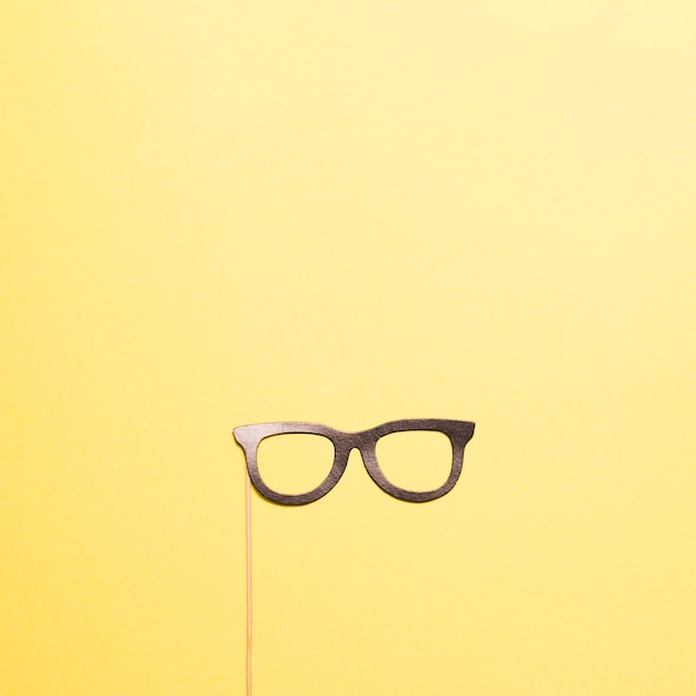 Download Free Photo Glasses Mask On Yellow PSD Mockup Templates