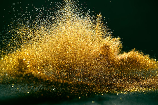 premium-photo-glitter-bombs-grunge-gold-glitter-defocused-abstract