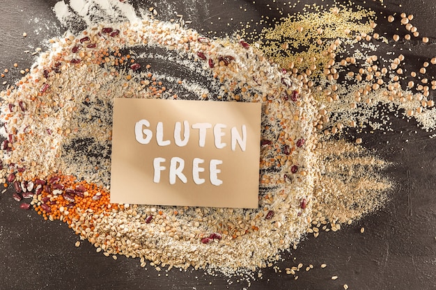 Gluten free flour and cereals millet, quinoa, corn bread, brown buckwheat, rice with text gluten free Free Photo