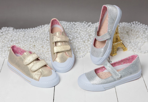Premium Photo | Gold color girl shoes
