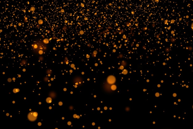 Premium Photo | Gold glitter powder splash background.