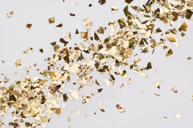 Premium Photo | Gold leaf confetti on white background. diagonal spread ...