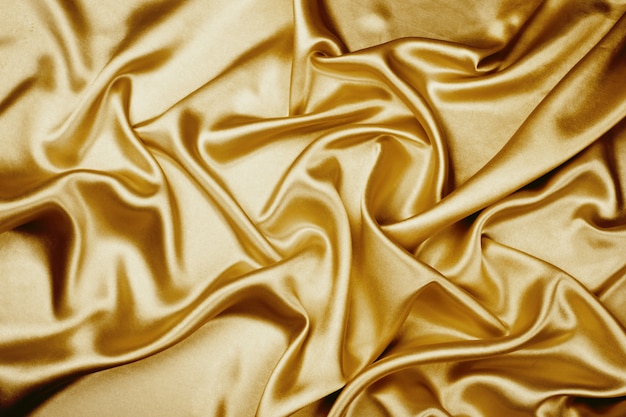 Premium Photo | Gold luxury satin fabric texture for background