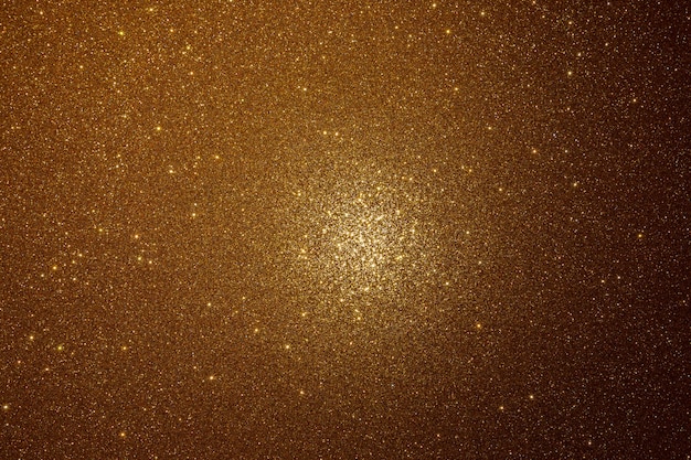 Premium Photo | Gold texture with sparkles and a spot of light in the ...