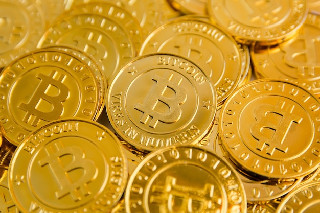Golden bitcoin coins background Premium Photo