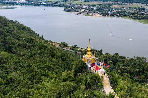 Download Free Golden Pagoda On Hill In Tropical Rainforest On Wat Ban Tham Use our free logo maker to create a logo and build your brand. Put your logo on business cards, promotional products, or your website for brand visibility.