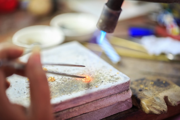 Premium Photo | Goldsmith making gold