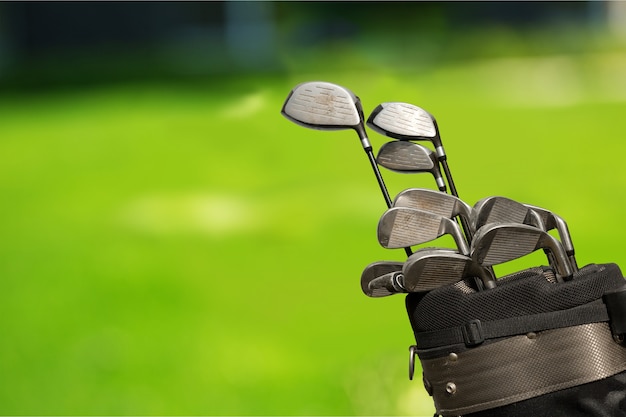 Premium Photo | Golf clubs drivers over background.