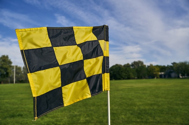 Premium Photo | Golf flagstick marking the location of the hole for ...