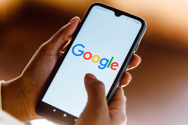 Google logo seen displayed on a smartphone Premium Photo