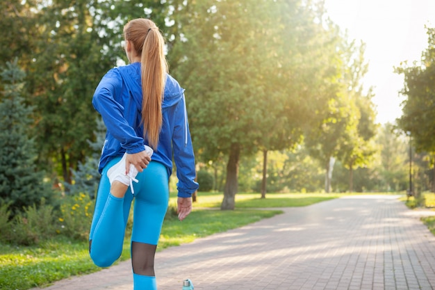 Premium Photo | Gorgeous athletic woman working out in the park in the ...