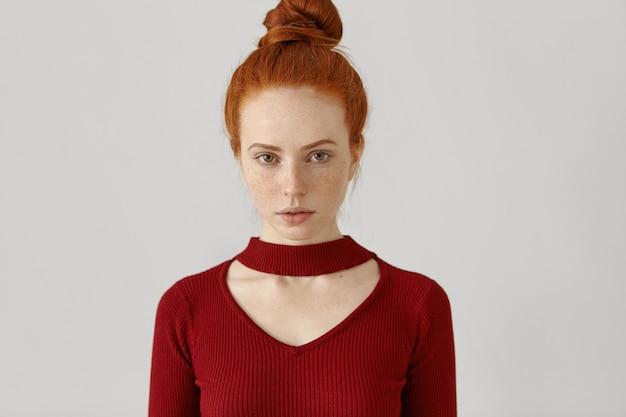 Free Photo Gorgeous Luxurious Caucasian Redhead Woman With Hair Bun And Freckles Wearing